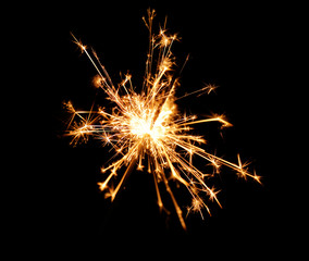 Fototapeta premium Beautiful sparkler on black background, close up