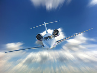 Private Jet airplane flying. Front view.