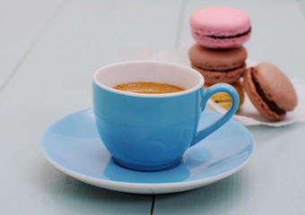 Blue Espresso Cup and stack of macarons biscuit