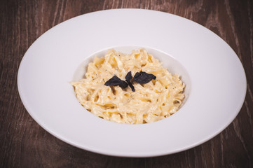 fresh  pasta carbonara on white plate
