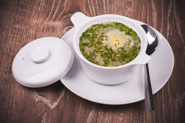 Chicken noodle soup in white plate