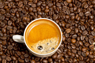 cup of coffee on linen cloth