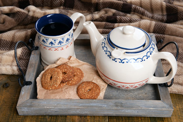 Cup of tea with cookies on table close-up