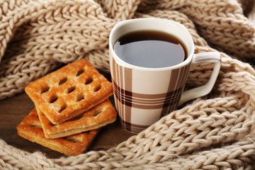 Cup of tea with cookies on table close-up
