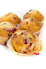 Cranberry muffins on white background. Selective focus.