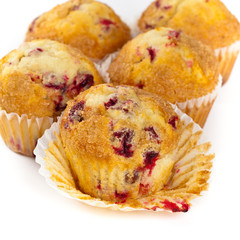 Cranberry muffins on white background. Selective focus.