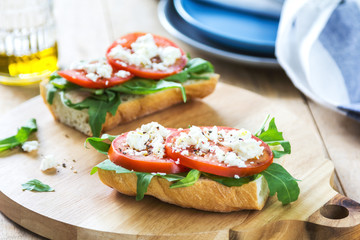 Feta with tomato and rocket sandwich