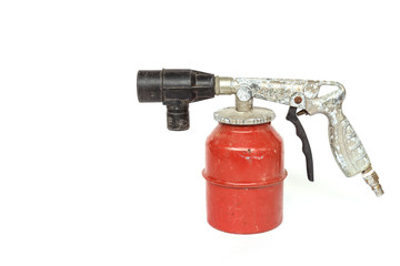 Old paint spray gun isolated on white background