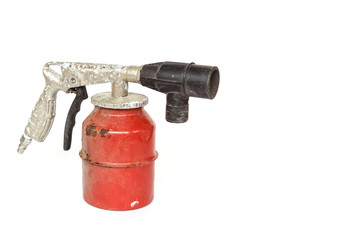 Old paint spray gun isolated on white background