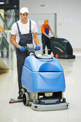male worker cleaning business hall