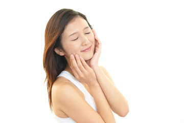 Fototapeta premium フェイスケアをする女性