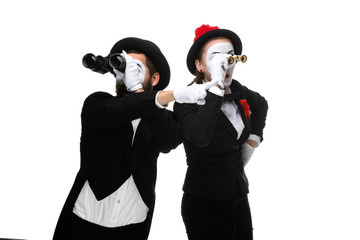 Two memes as business people looking through binoculars