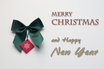 Fototapeta na wymiar Green Christmas ribbon with text on white background