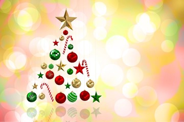 Composite image of christmas tree shape of baubles