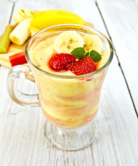 Dessert milk strawberry and banana on light board