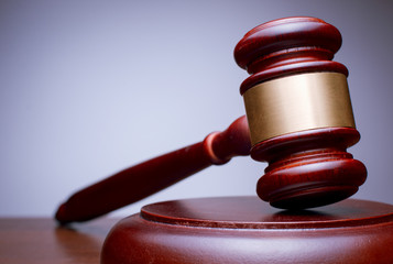 Obraz premium Close Up Brown Wooden Gavel with Gold Dress