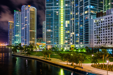 Fototapeta na wymiar Buildings along the Miami River at night, in downtown Miami, Flo