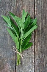 sage on wooden surface
