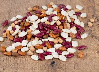 various beans on wooden surface