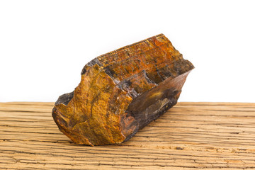 Brown petrified wood oak surface white background front focus.