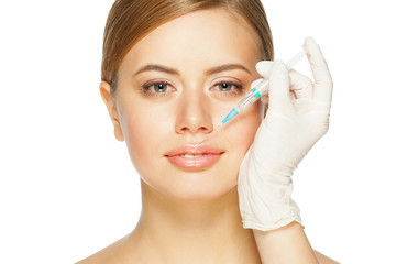 Cosmetic injection to young woman's lips