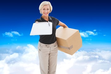 Composite image of happy delivery woman looking for signature