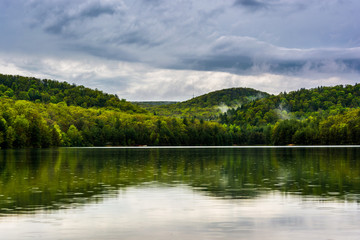 Clearing storm clouds over Long Pine Run Reservoir, in Michaux S