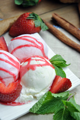 Bowl of ice cream with vanilla and strawberry