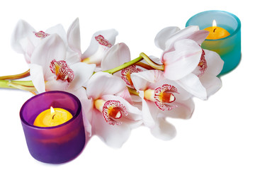 Fototapeta na wymiar Branch of white orchid and candles