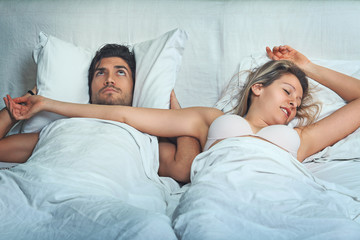 Man awake by woman snoring