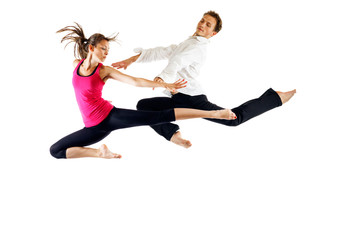 Modern ballet dancers, male and female in the jump