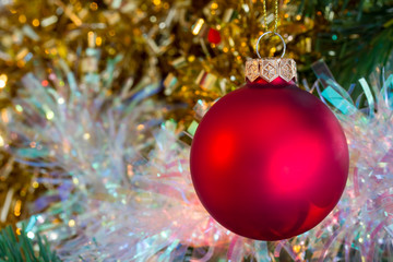 Christmas red bauble with tinsel