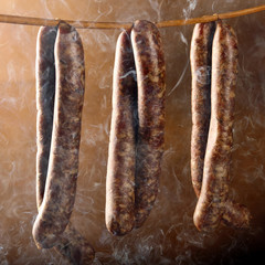 Smoked sausage in a haze of smoke