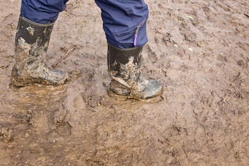 Muddy rubber boots