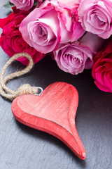 red and pink  roses  on table