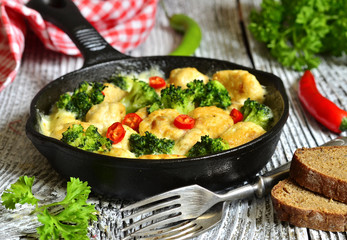 Chicken meatballs with broccoli.