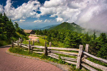 Fototapeta na wymiar Fence along a trail and view of the Appalachians from Mount Mitc