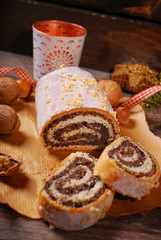 traditional christmas poppy seed cake on wooden table