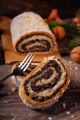 traditional christmas poppy seed cake on wooden table