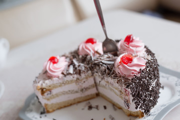Cake with creamy flowers on  large plate