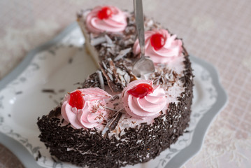 Cake with creamy flowers on  large plate