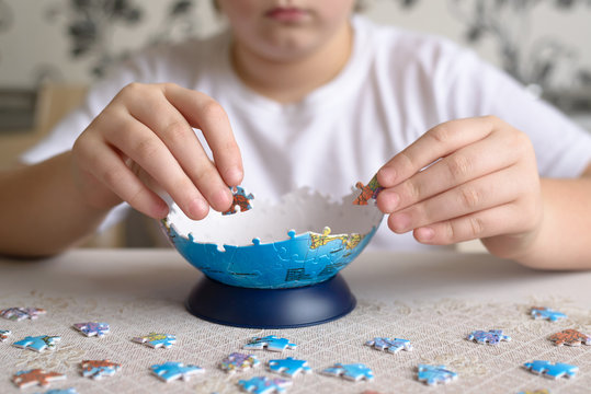 Teenager boy collects puzzles from Globe
