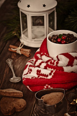 Gingerbread cookies and spices over wooden background 