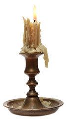 burning old candle vintage bronze candlestick.