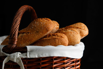 Bread basket on black background