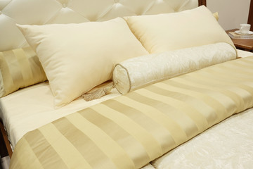 closeup of two pillows and bolster