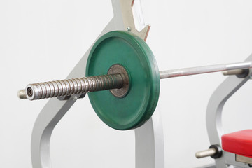 barbell with a green disc