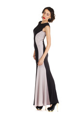 Naklejka premium Portrait in full growth of a young woman in long evening dress