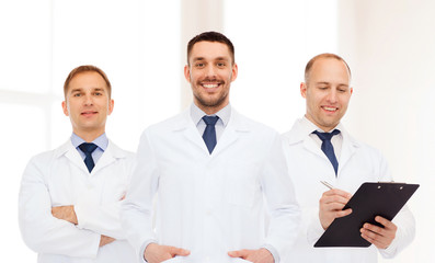 Fototapeta premium group of smiling male doctors in white coats