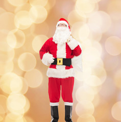 man in costume of santa claus with bag